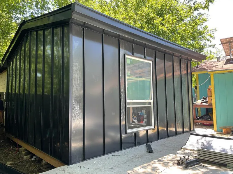 Black standing seam metal wall panels for Roof Inspection in Plantation