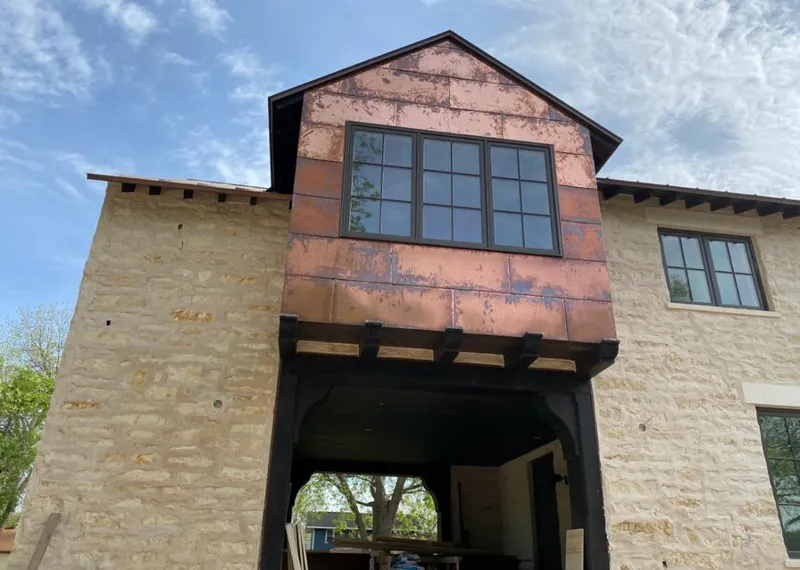 Copper metal panel facade on a stone building for Roof Repair in Plantation