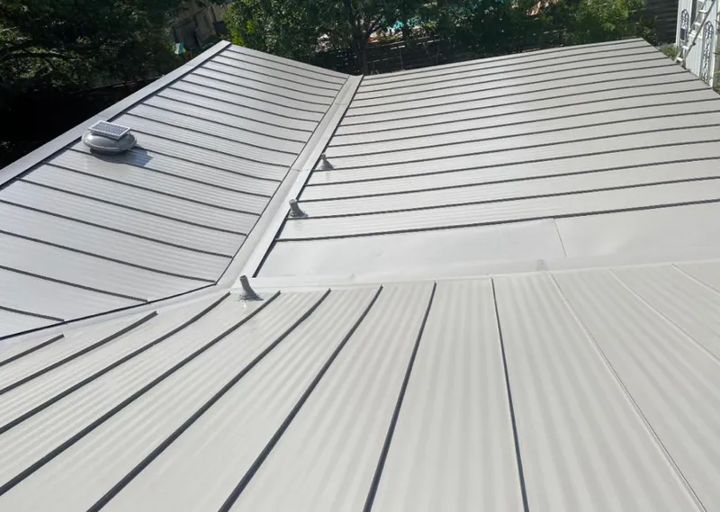 Solar attic fan installed on a metal roof for Roof Ventilation in Plantation